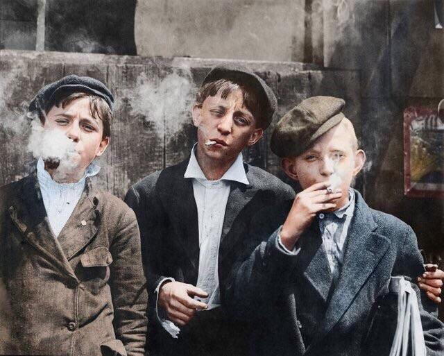 Paperboys on smoke break, circa 1910