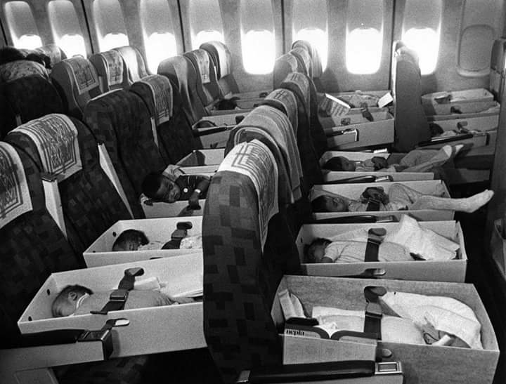 Orphaned babies being transported to the US after their parents died in the Vietnam War in 1975