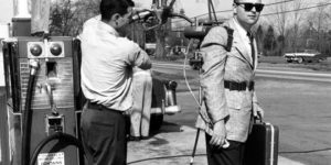 A salesman and his motorized roller skates.