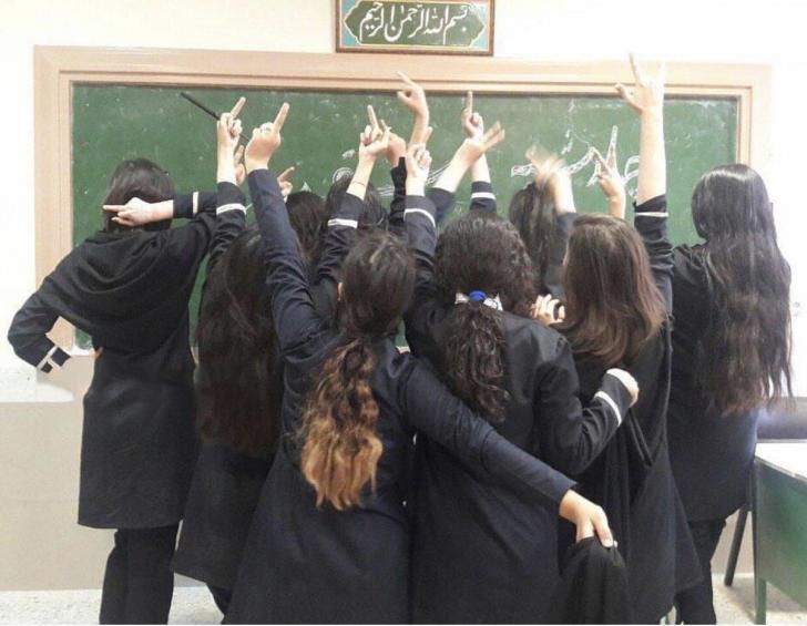 Iranian girls to the regime in Iran and its compulsory hijab rules.