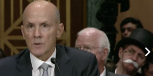 Monopoly Man in background during Equifax Senate Hearing
