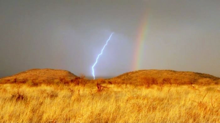 Seeing lightning and rainbow at the same time in Africa.
