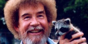 Bob Ross holding a baby trash panda