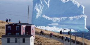 90% Underwater: residents view the first iceberg of the season as it passes the South Shore, also known as IÅ“Iceberg Alley, near Ferryland Newfoundland, Canada.