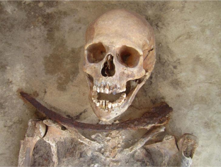 Vampire prevention burial in 17th century Poland with sickle across the throat. The sickles were intended to decapitate the dead if they tried to rise from the grave.