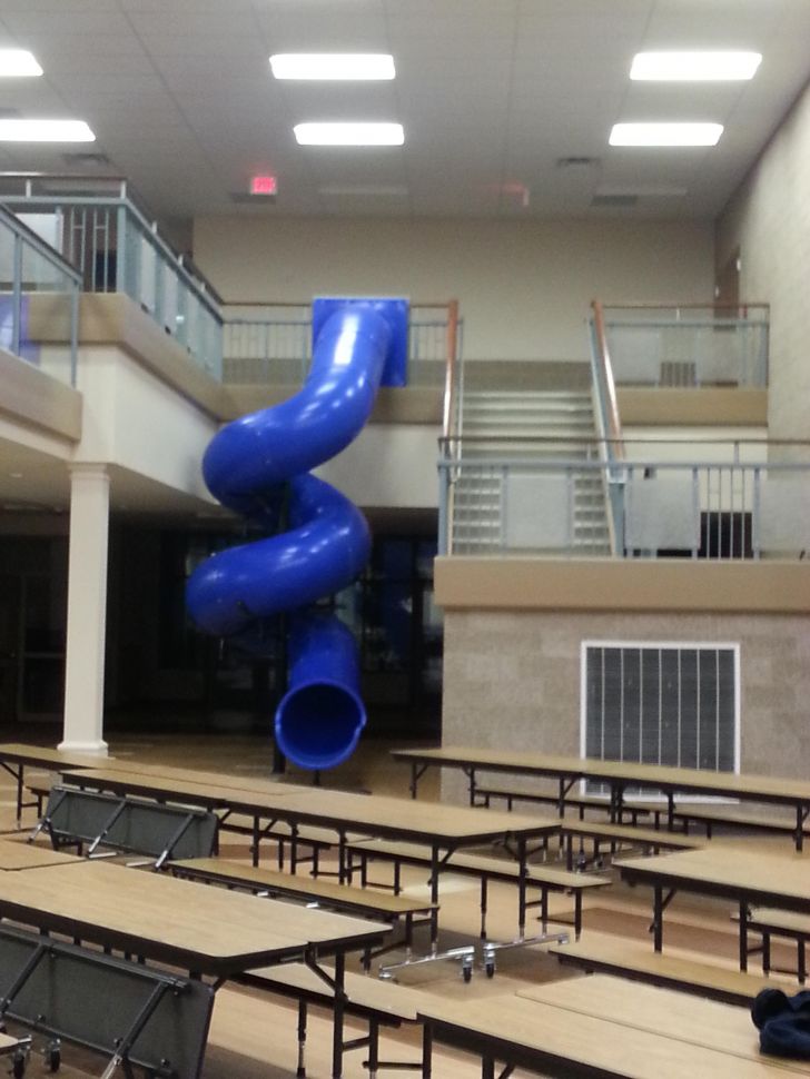 This school has a twirly slide to get downstairs!