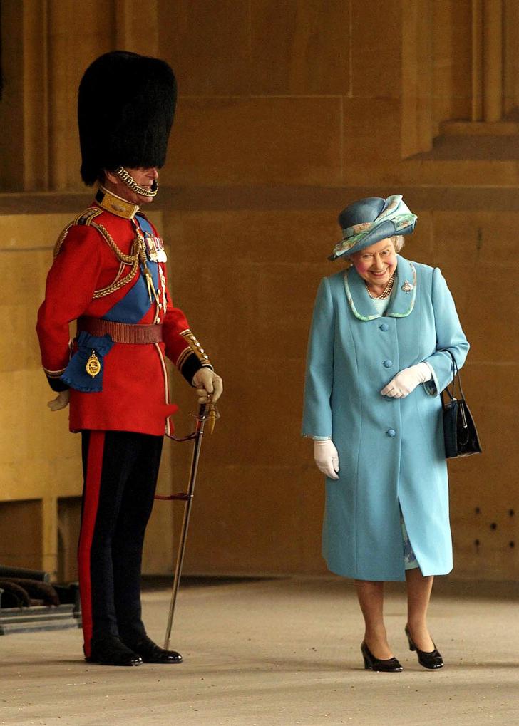 The Queen having a giggle at Prince Philip dressed as a Queen's guardsman