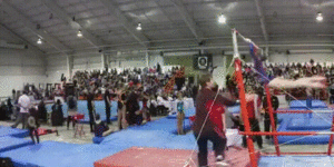 Gymnastics coach makes an amazing catch.