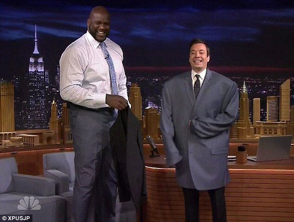 Jimmy Fallon wearing Shaq's jacket.