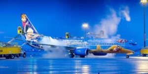 Airport ground crews de-icing a Frozen plane