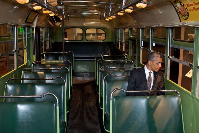 Obama sitting in Rosa Parks' seat.