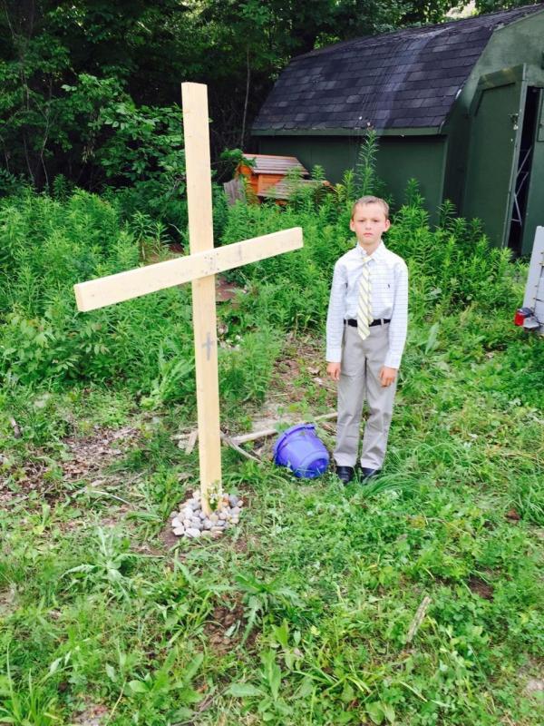 My little cousin’s turtle died. He made the grave, built the cross, and got dressed without any parental supervision. My uncle caught this towards the end of the ceremony.