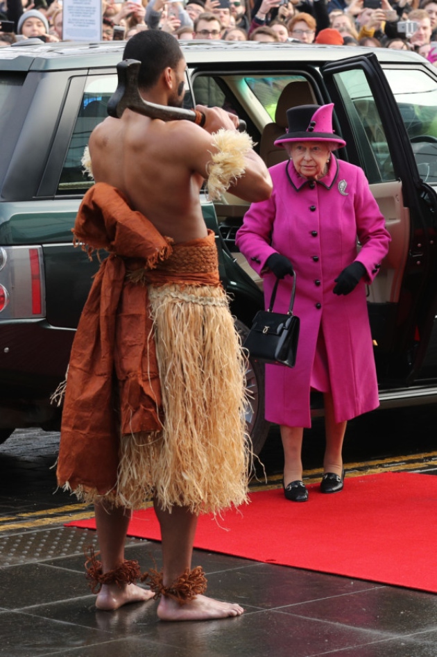 Queen Greeted by Fijian Warrior