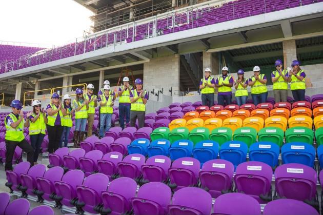 Orlando city soccer unveils 49 Rainbow-colored seats at its new stadium to honour the victims of the June shooting at pulse nightclub.