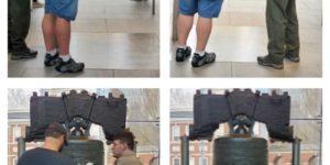 Bell center employee helps a blind citizen experience the liberty bell.