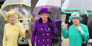 Queen Elizabeth carries her own umbrella, in style.