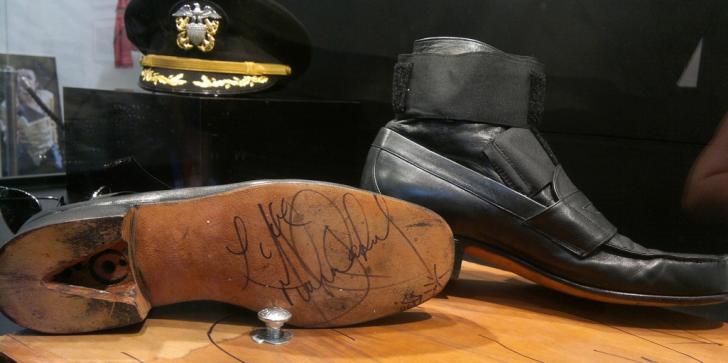 Michael Jackson's special shoes next to the floor bolts that were used for him to do his famous gravity-defying lean