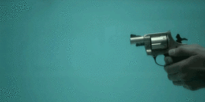 Revolver being shot underwater.