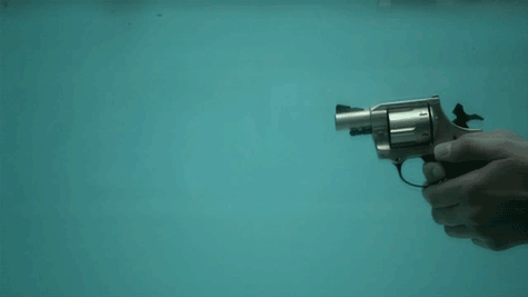 Revolver being shot underwater.