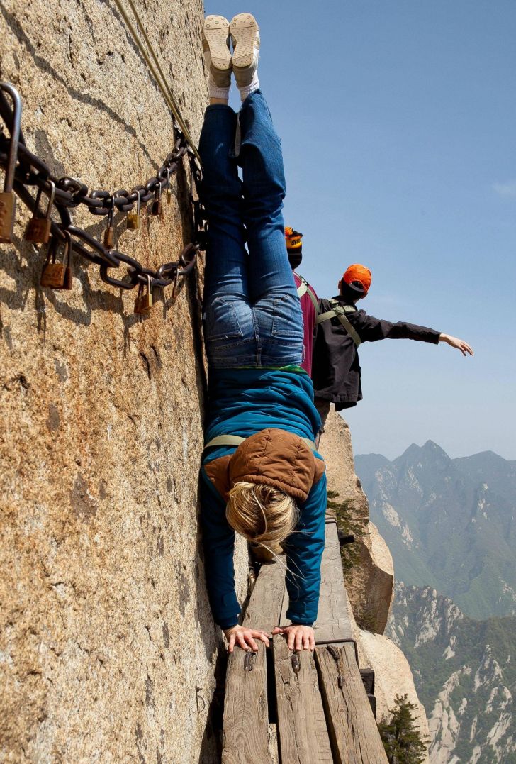 Crazy chick does a crazy trick: Handstands on Mt Huashan