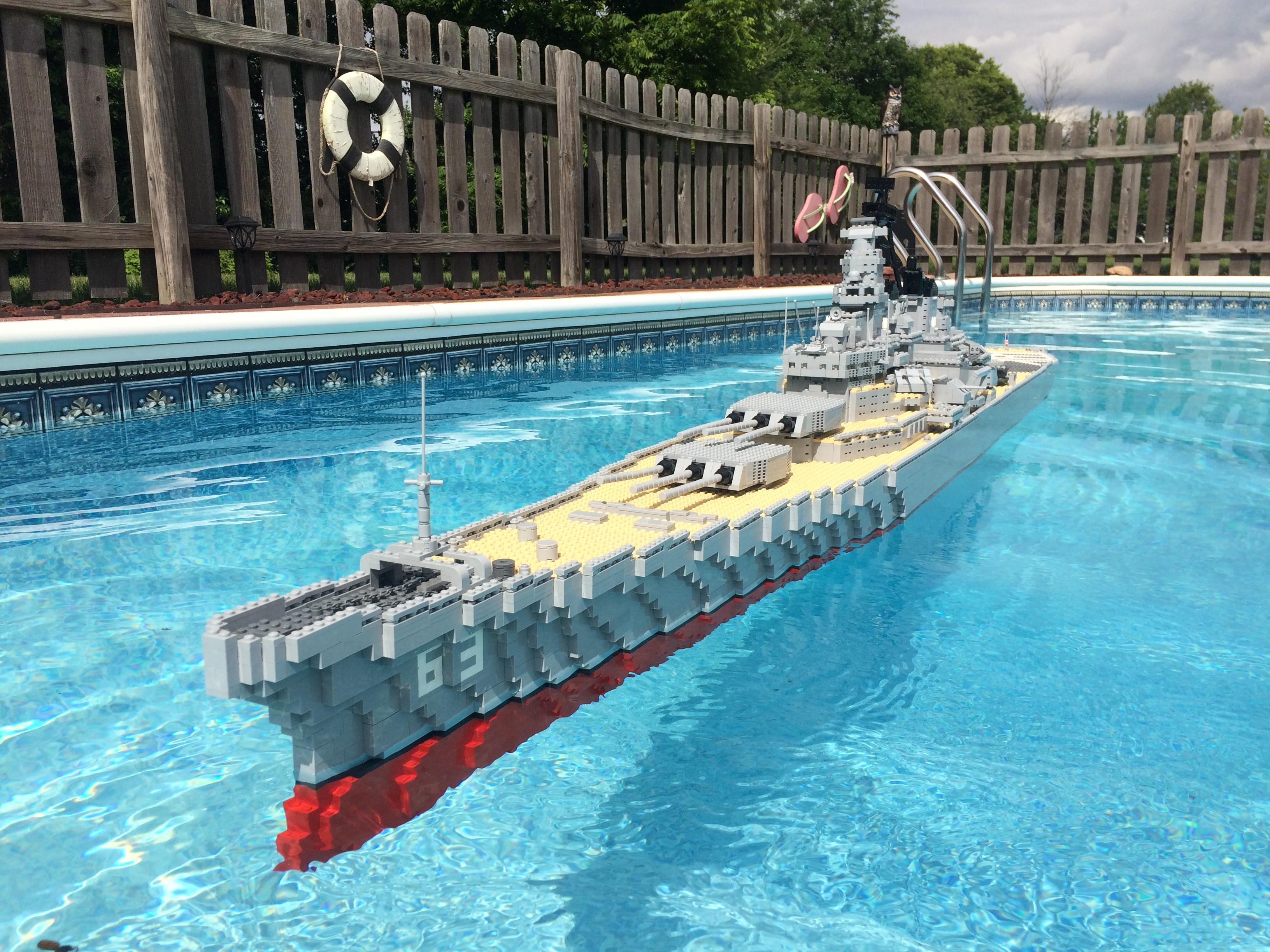 Life size LEGO Battleship in a pool.