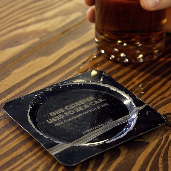 Local bar has metal coasters made from cars wrecked in drunk driving accidents for St. Patrick's Day