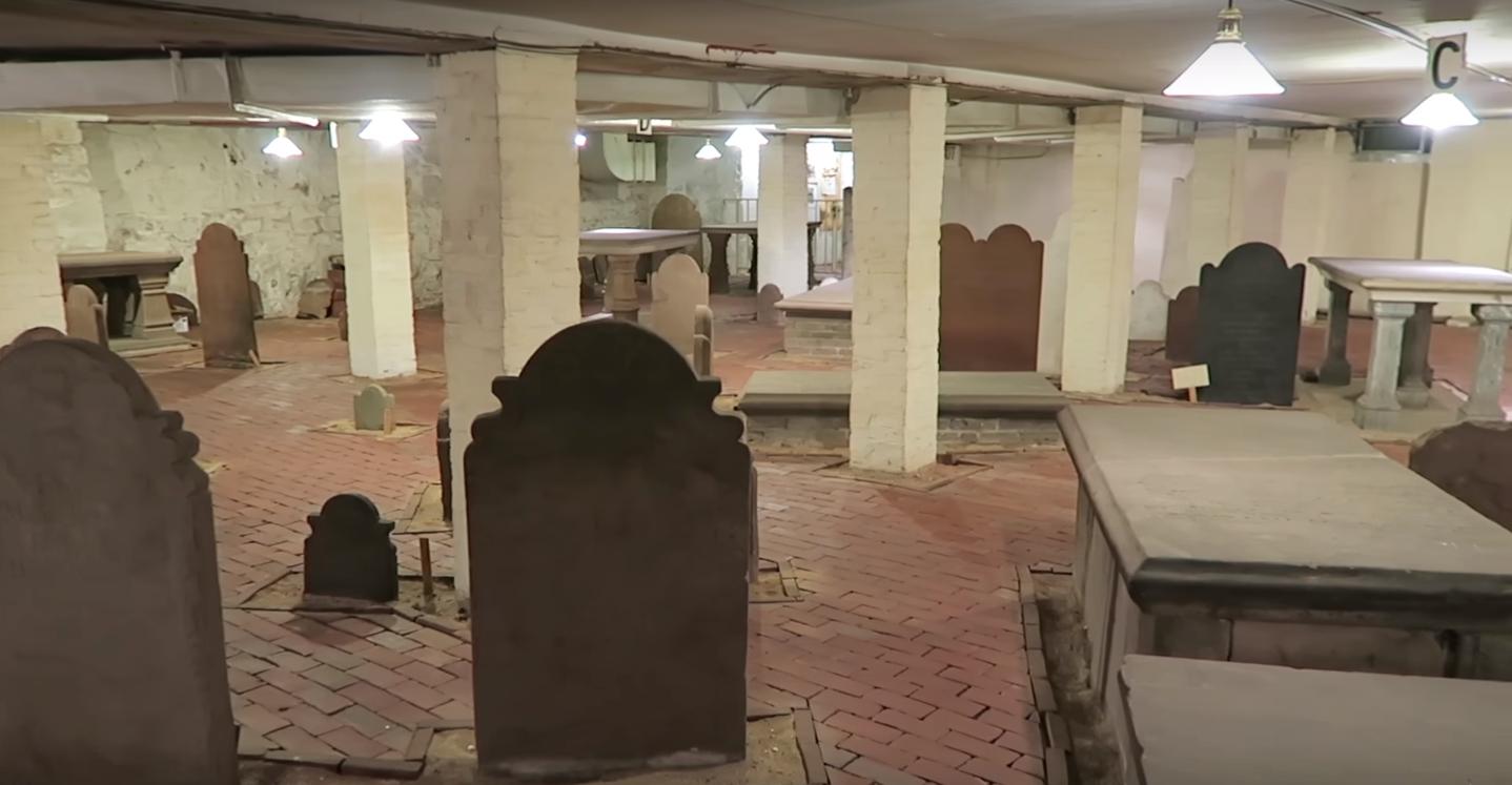 Untouched 1800's Cemetery preserved in the basement of a building built over it.