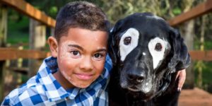 8-Year-Old Boy Embarrassed Of Vitiligo Meets Dog With Same Skin Condition