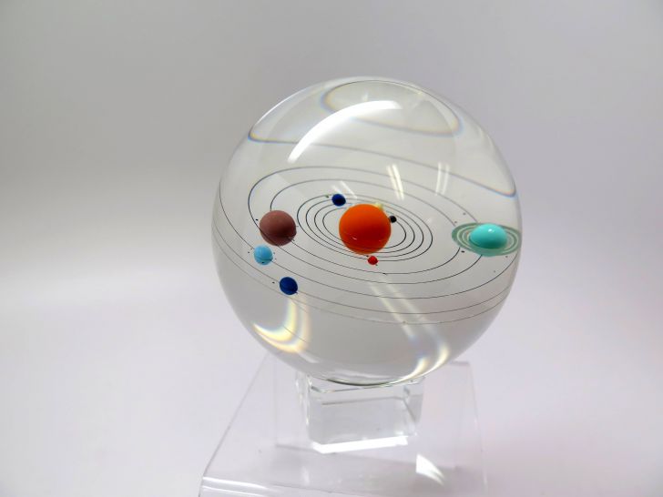 Handmade glass globe of the solar system. And Pluto.