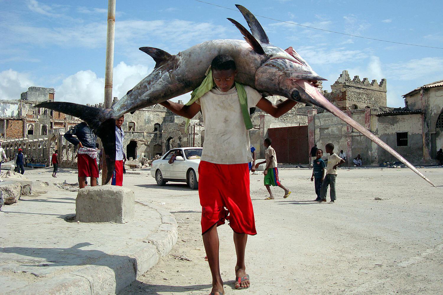 A Somali fisherman with his prize.
