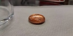 60 drops of water on a coin!