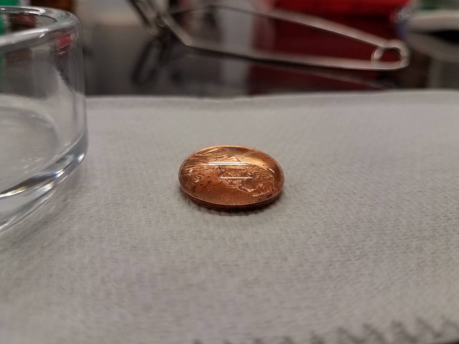 60 drops of water on a coin!