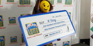 Lottery winner shows up in an emoji mask. Well played.