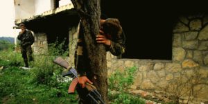 A Bosnian Soldier hugs tree and cries. War is Hell.