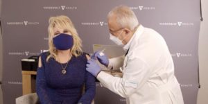 Dolly Parton has custom made vaccination blouses.