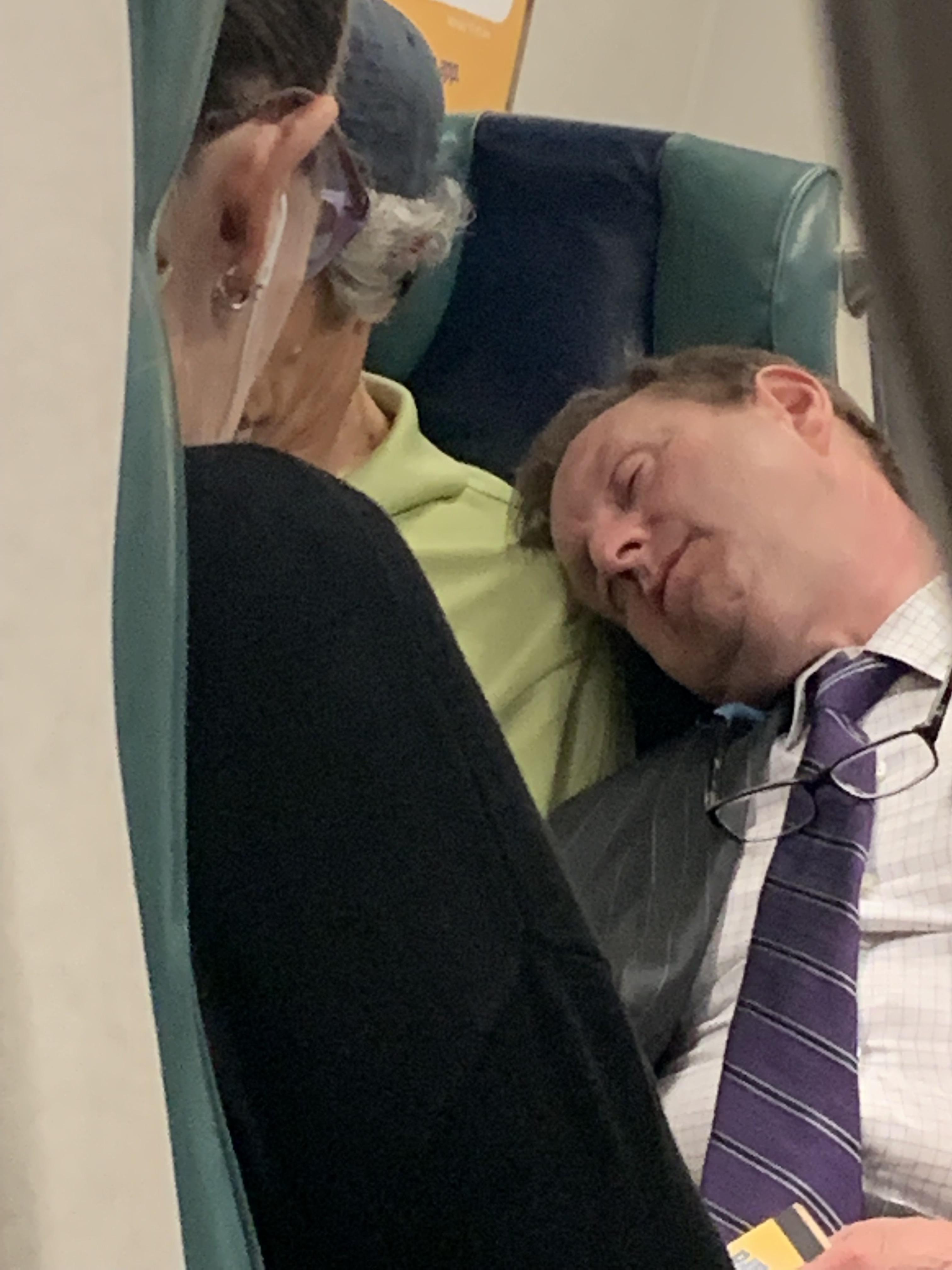 A decent guy let an exhausted business man sleep on him during his commute.