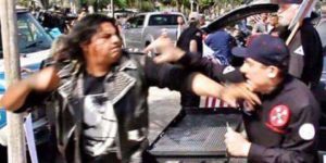 A punk about to knockout a klan member.