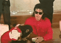 Michael Jackson tells his chimp Bubbles to sit down in sign language