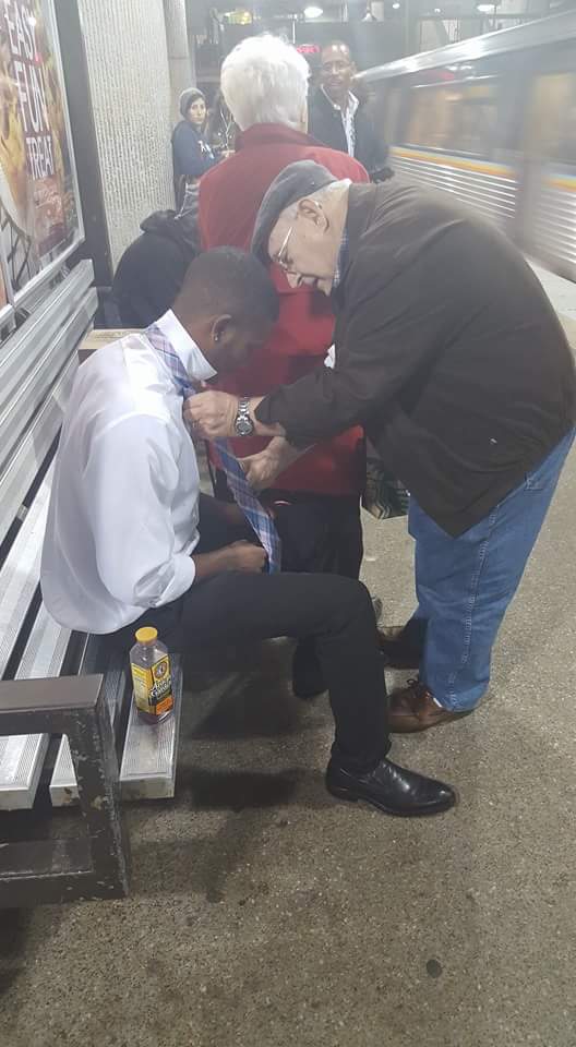 Teaching a stranger how to tie a tie on the subway