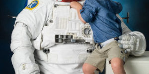 NASA astronaut Anne McClain brought her 4-year-old son to a spacesuit photo shoot.