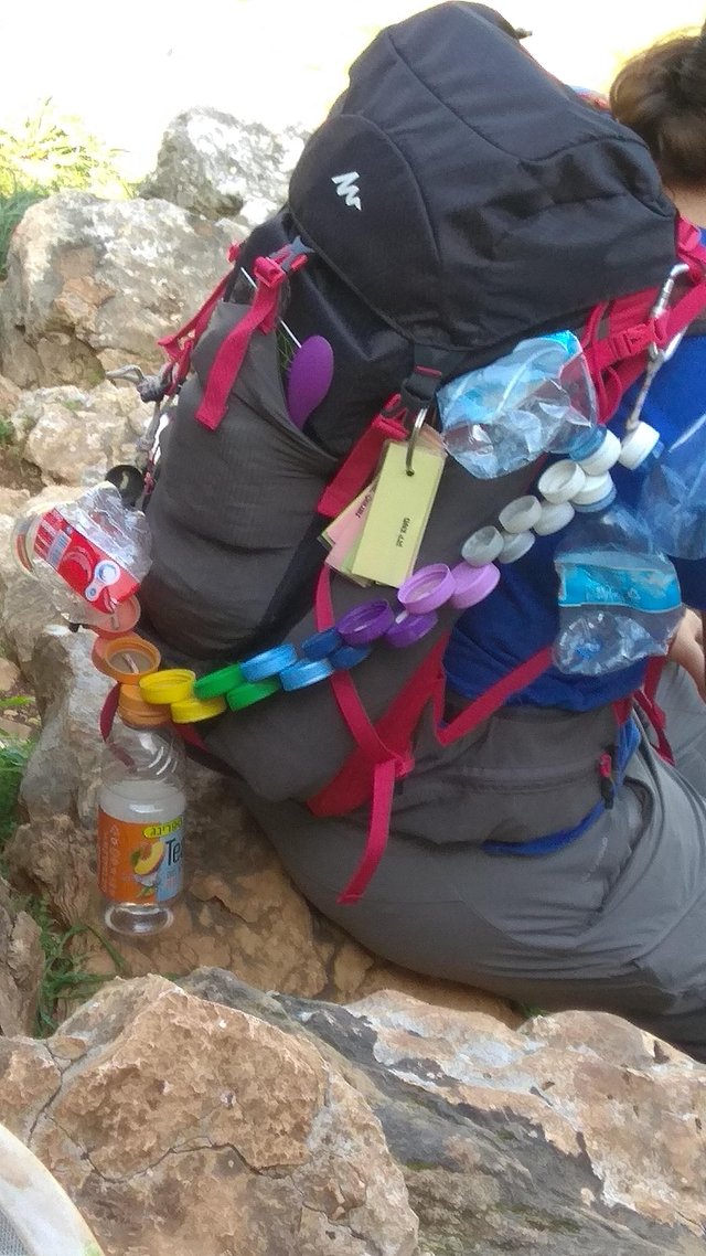 Trail guide's belt for picking up littered bottles belonging to sub-humans along the trail.