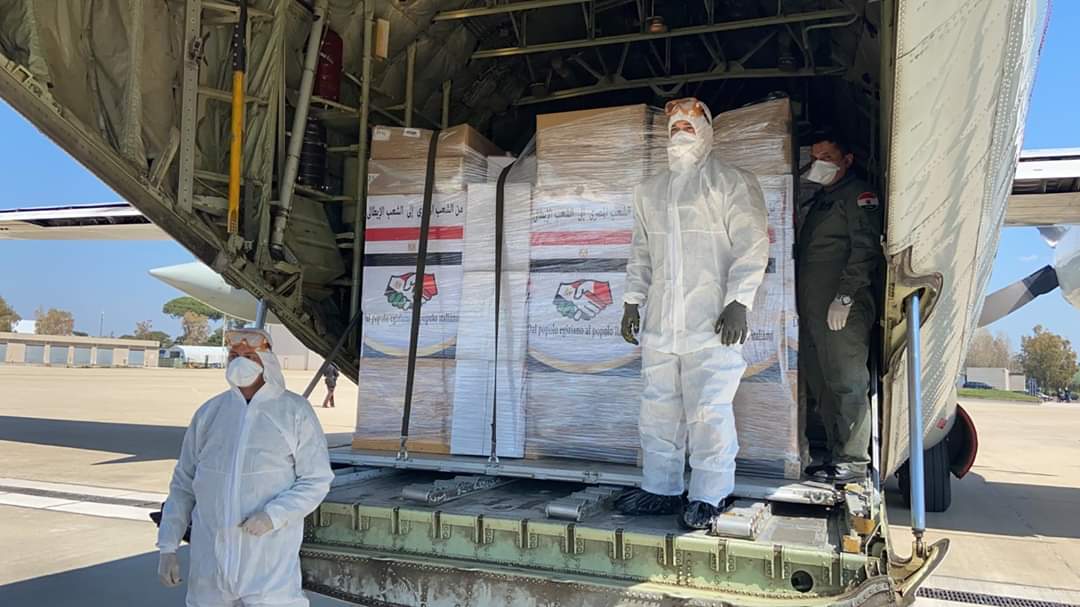 Egyptian military aircraft filled with with health aid has just landed in Italy. 'From Egypt to Italy, with love' is written on the packages.