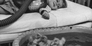 Ducks keep a girl suffering from polio company – circa 1956