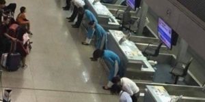 Flight delayed in Japan. Airline employees bow to the passengers to apologise.