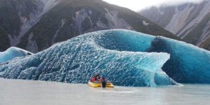 The dark blue bottom of an iceberg that rolled over