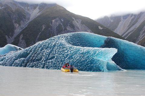 The dark blue bottom of an iceberg that rolled over