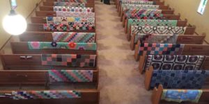 Woman made quilts for those she loved while she was alive. This was taken at her funeral.