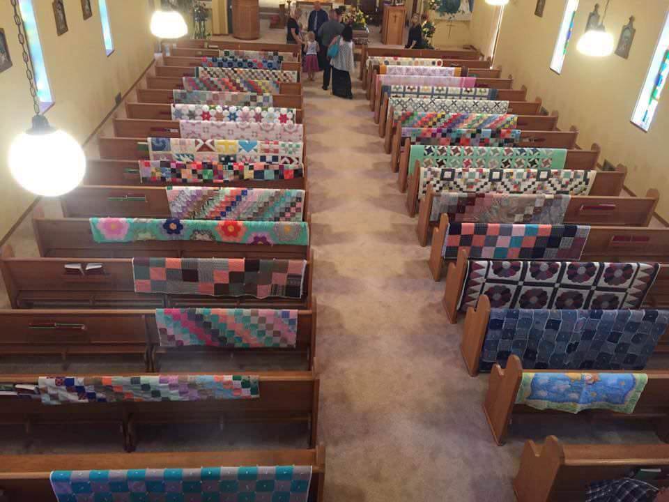 Woman made quilts for those she loved while she was alive. This was taken at her funeral.