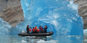 The Brilliant Blue of a Rolling Iceberg in Alaska