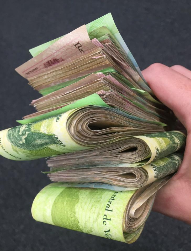 The maximum amount you can get out a day at an ATM in Venezuela. It's worth about $25 and is a full fistful of cash.